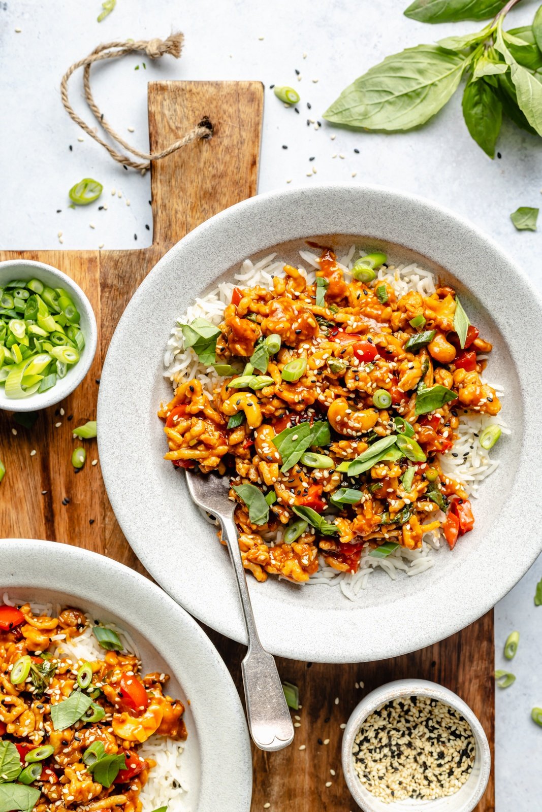 gochujang chicken stir fry in a bowl with rice